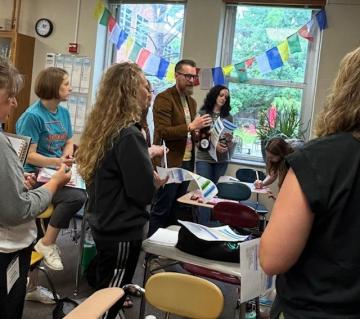 Teachers working together on a project at the MASL 2025 Summer Professional Development event